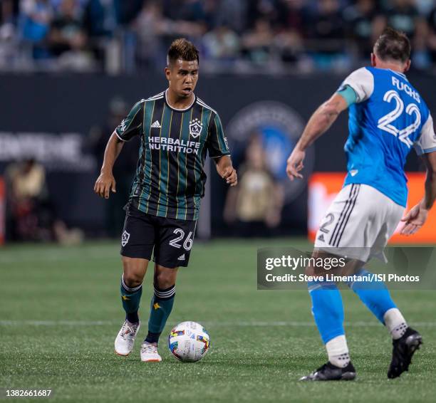 Efraín Álvarez advances the ball during a game between Los Angeles Galaxy and Charlotte FC at Bank of America Stadium on March 5, 2022 in Charlotte,...