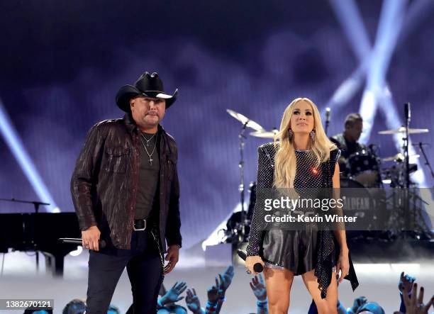 Jason Aldean and Carrie Underwood perform onstage during the 57th Academy of Country Music Awards at Allegiant Stadium on March 07, 2022 in Las...