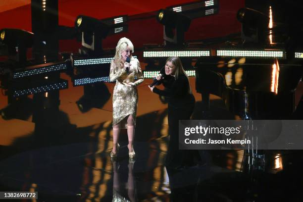 Dolly Parton and Kelly Clarkson speak onstage during the 57th Academy of Country Music Awards at Allegiant Stadium on March 07, 2022 in Las Vegas,...