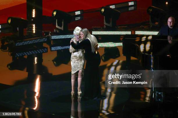 Dolly Parton and Kelly Clarkson speak onstage during the 57th Academy of Country Music Awards at Allegiant Stadium on March 07, 2022 in Las Vegas,...