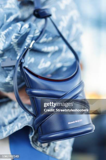 Best Ager Model and Influencer Petra van Bremen wearing a dark blue bag by Alexander McQueen during a street style shooting on March 7, 2022 in...