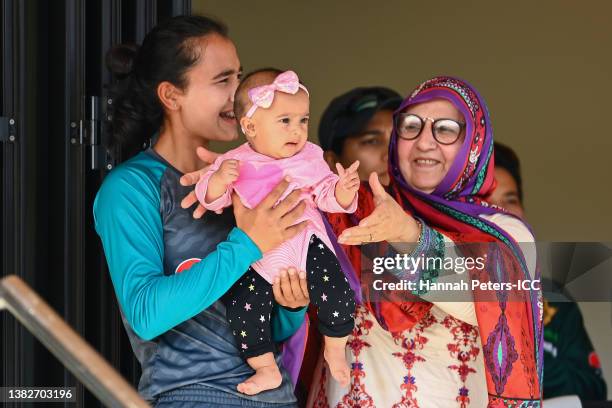 Daughter of Bismah Maroof of Pakistan, Fatima, celebrates her mother's half century from the pavilion during the 2022 ICC Women's Cricket World Cup...