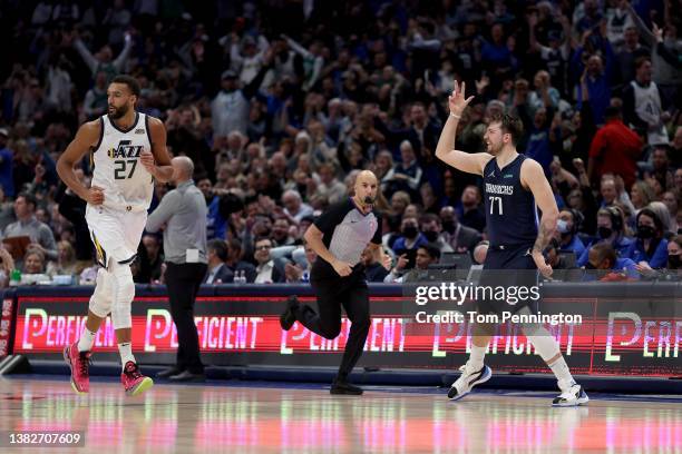 Luka Doncic of the Dallas Mavericks reacts after scoring a three-point shot against Rudy Gobert of the Utah Jazz in the second half at American...