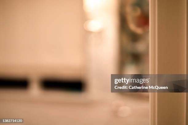 defocused view of open inset glass medicine cabinet & window in bathroom with door slightly ajar - standing mirror stock pictures, royalty-free photos & images