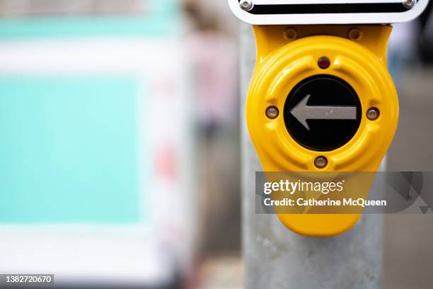 this way: silver arrow on pedestrian crosswalk button - city sensors stock pictures, royalty-free photos & images