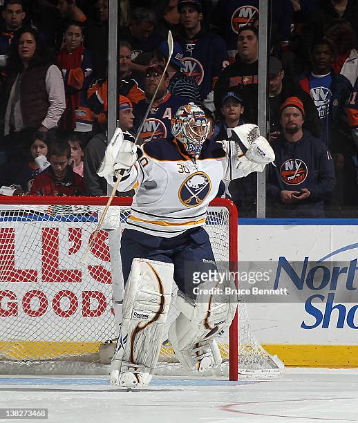 Ryan Miller of the Buffalo Sabres celebrates the Sabres 4-3 shoot out victory over the New York Islanders at the Nassau Veterans Memorial Coliseum on...