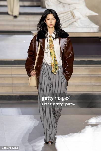 HoYeon Jung walks the runway during the Louis Vuitton Womenswear Fall/Winter 2022-2023 show as part of Paris Fashion Week on March 07, 2022 in Paris,...