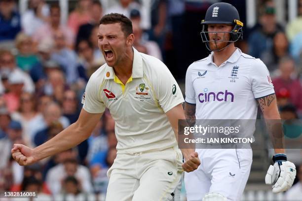 England's captain Ben Stokes reacts as Australia's Josh Hazlewood celebrates taking the wicket of England's Ben Duckett for 83 runs on day five of...