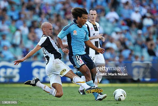 Ruben Zadkovich of the Jets tackles Nick Carle of Sydney during the round 18 NBL match between Sydney FC and the Newcastle Jets at Sydney Football...