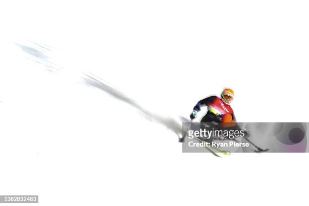 Akira Kano of Team Japan competes in the Para Alpine Skiing Men's Super Combined Slalom Sitting at Yanqing National Alpine Skiing Centre during day...