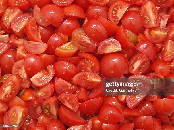 chopped tomatoes - beefsteak tomato stock pictures, royalty-free photos & images