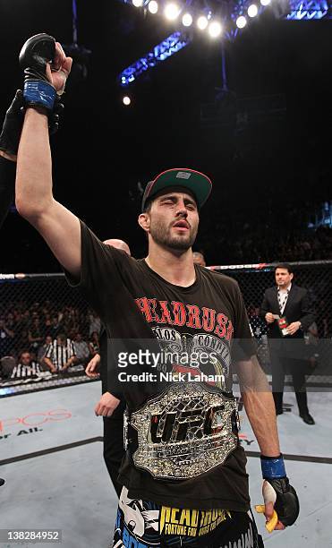 Carlos Condit receives the interim UFC welterweight championship belt after defeating Nick Diaz during the UFC 143 event at Mandalay Bay Events...