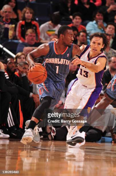 Kemba Walker of the Charlotte Bobcats moves the ball against Steve Nash of the Phoenix Suns on February 4, 2012 at U.S. Airways Center in Phoenix,...