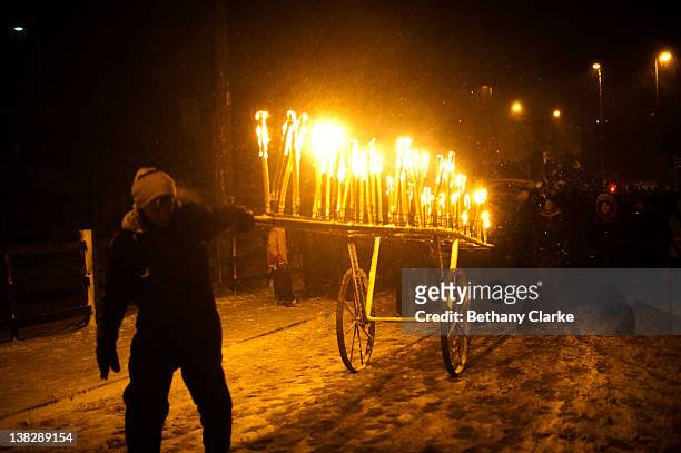 Torches for the winter procession through the snow on February 4, 2012 in Huddersfield, England. Imbolc is a pagan festival that marks the half way...