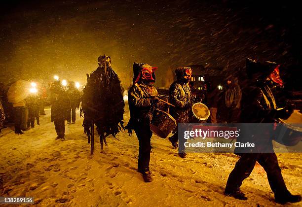 The winter procession walks through the snow on February 4, 2012 in Huddersfield, England. Imbolc is a pagan festival that marks the half way point...