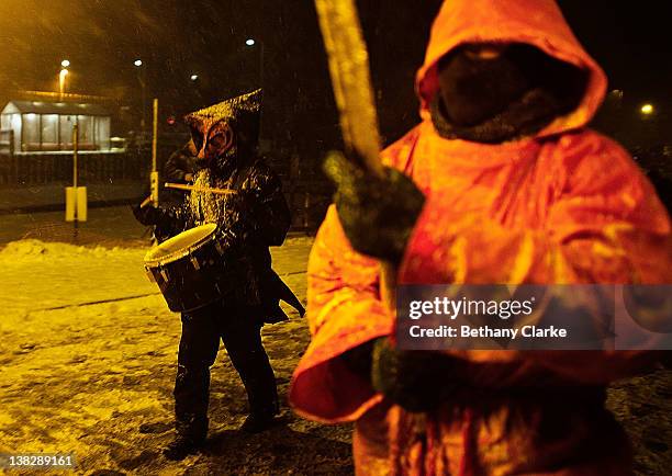 The winter procession walks through the snow on February 4, 2012 in Huddersfield, England. Imbolc is a pagan festival that marks the half way point...