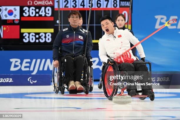 Zhang Mingliang of Team China competes during the Wheelchair Curling Round Robin Session 7 between China and South Korea on day three of the Beijing...