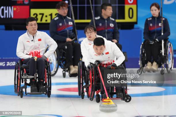 Zhang Mingliang of Team China competes during the Wheelchair Curling Round Robin Session 7 between China and South Korea on day three of the Beijing...