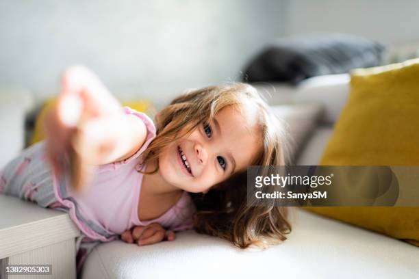 portrait of a beautiful girl having fun - giving a girl head stock pictures, royalty-free photos & images