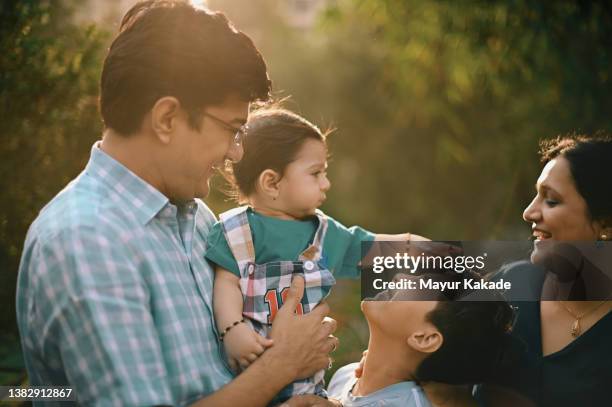 close-up of a family with two children - indian family stock-fotos und bilder