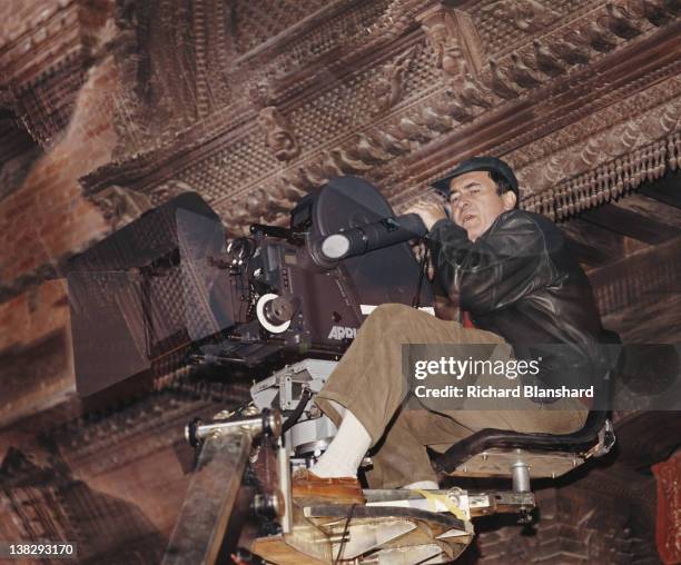 Director Bernardo Bertolucci on the set of the film 'Little Buddha', circa 1992.