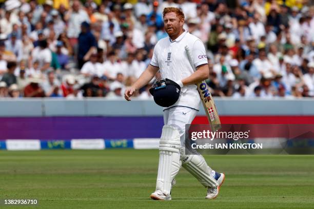 England's Jonny Bairstow walks back to the pavilion after losing his wicket for 10 runs on day five of the second Ashes cricket Test match between...