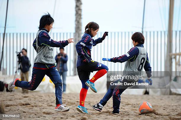 Nahomi Kawasumi of INAC Kobe Leonessa Ladies duels for the ball with her teammates during a training session at the Club Natacion Barcelona sport...