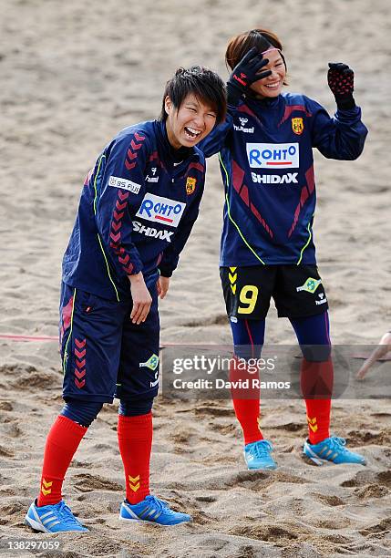 Chiaki Minamiyama and Nahomi Kawasumi of INAC Kobe Leonessa Ladies laugh during a training session at the Club Natacion Barcelona sport complex in La...
