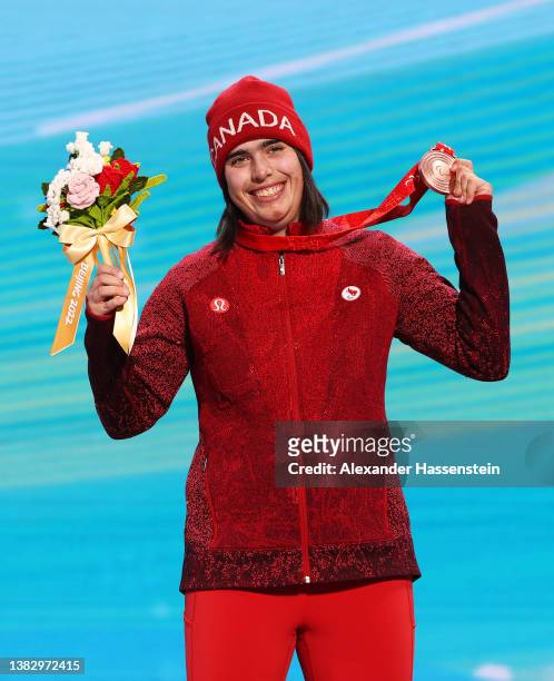 Bronze medallist Alana Ramsay of Team Canada celebrates during the Women's Para Alpine Skiing Super Combined Sitting Standing medal ceremony at the...