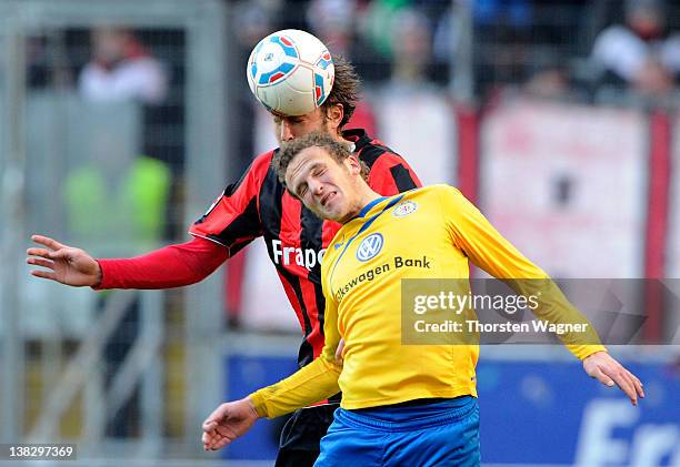 Heiko Butscher of Frankfurt battles for the ball with Julius Reinhardt of Braunschweig during the second Bundesliga match between Eintracht Frankfurt...