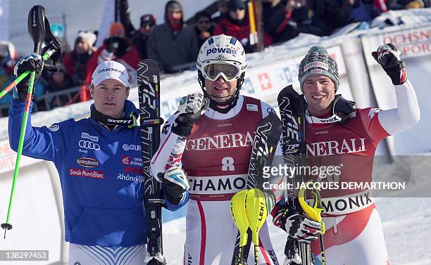 France's Alexis Pinturault, Austria's Romed Baumann and Switzerland's Beate Feuz celebrate after the Kandahar Men's Super Combined event during the...