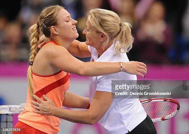 Angelique Kerber of Germany and teamcaptain Barbara Rittner hug during day two of the Federation Cup 2012 match between Germany and Czech Republic at...