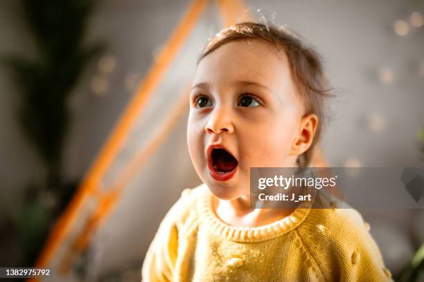 cute little baby girl portrait. - baby spielt mit essen stock-fotos und bilder