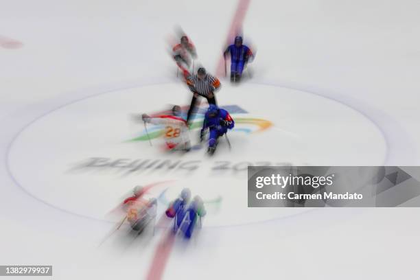 Jintao Tian of Team China and Roberto Radice of Team Italy face off during the Preliminary Round Group B Para Ice Hockey game between Italy and China...