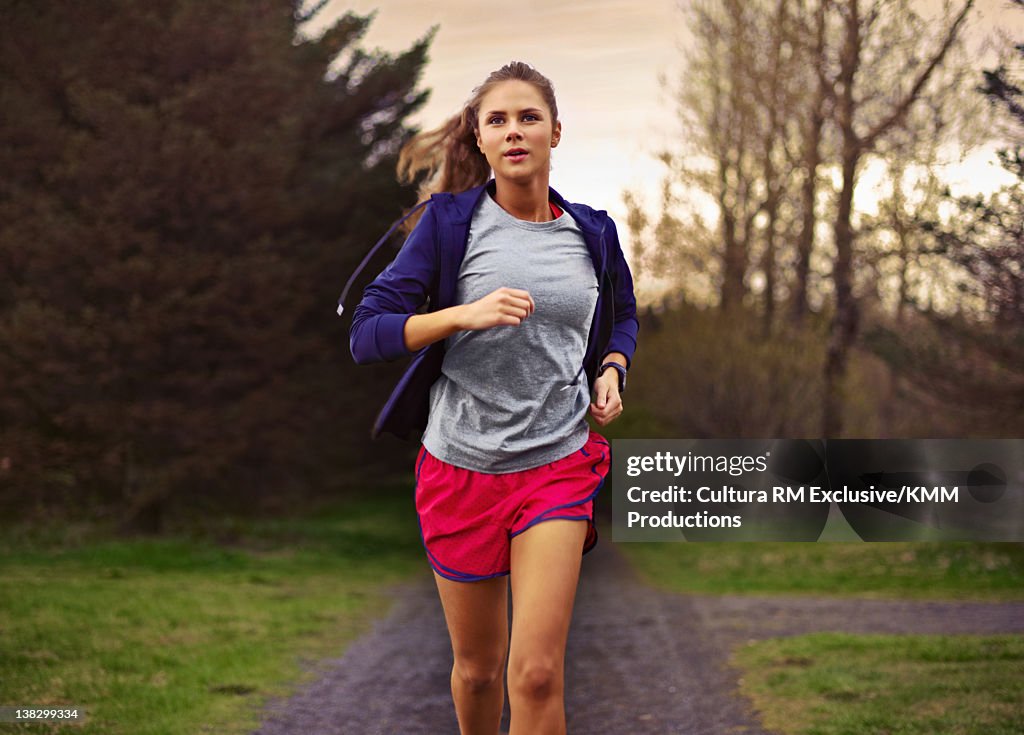 Teenage girl running in park