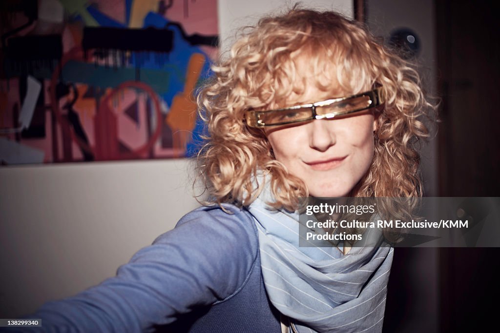 Woman wearing sunglasses indoors