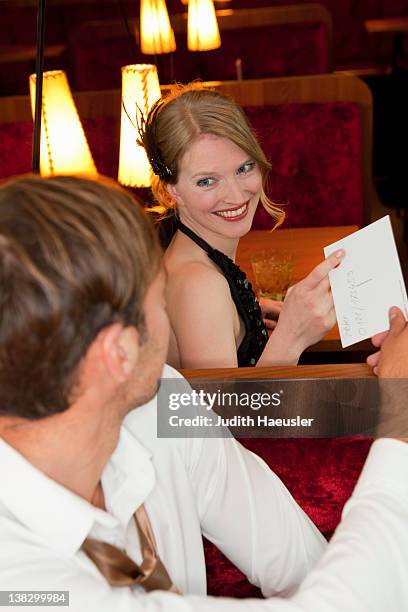 man sharing menu in restaurant - telephone number stock pictures, royalty-free photos & images