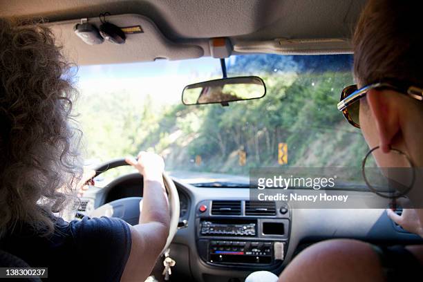 women riding in car - daughter car stock pictures, royalty-free photos & images