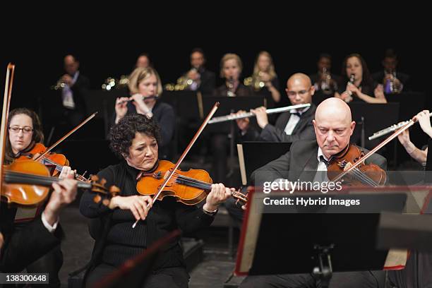string section in orchestra - orchestra foto e immagini stock