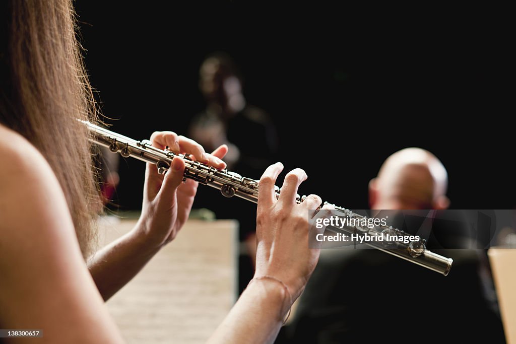 Flute player in orchestra