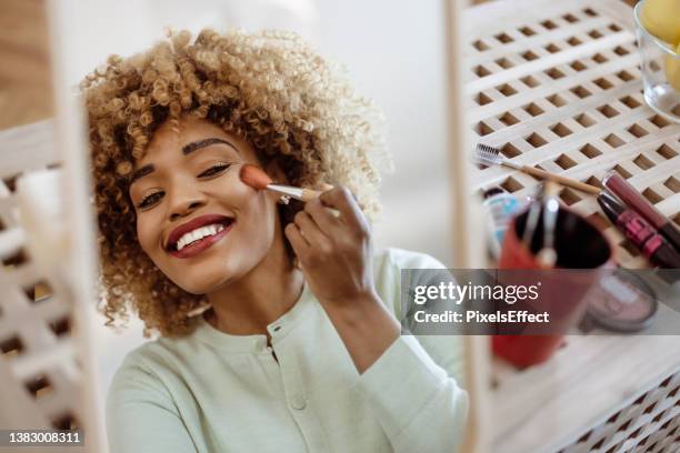 accenting her beauty - applying makeup stock pictures, royalty-free photos & images