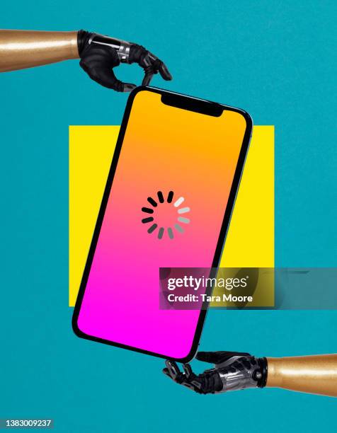 robotic hands holding mobile phone with loading icon - downloading software stock pictures, royalty-free photos & images