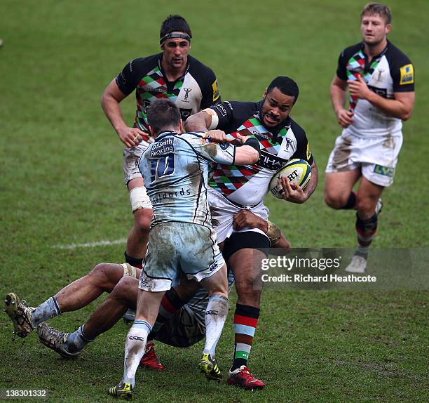 Darryl Marfo of Quins is tackled by Ceri Sweeney of Cardiff during the LV= Cup match between Cardiff Blues and Harlequins at the Cardiff City Stadium...