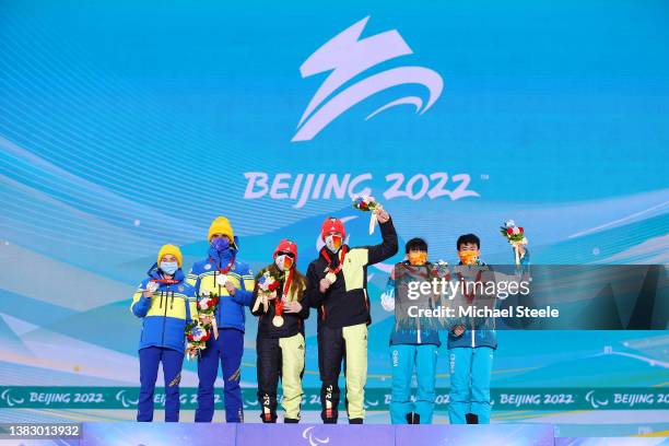 Gold medallist Leonie Maria Walter of Team Germany and their guide Pirmin Strecker, Silver medallist Oksana Shyshkova of Team Ukraine and their guide...