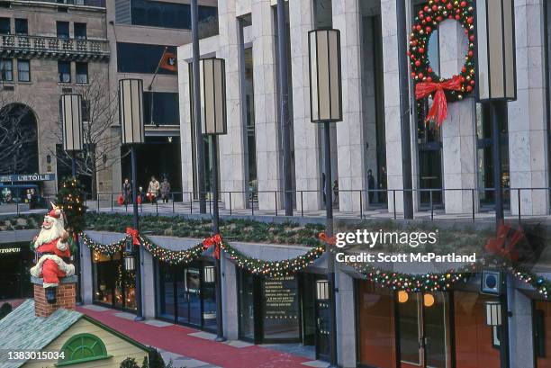 Elevated view across the sunken courtyard outside the General Motors Building on 5th Avenue decorated for the holidays, New York, New York, December...