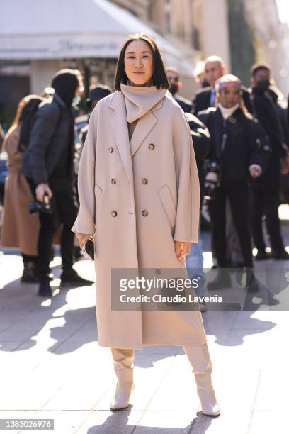 Eva Chen wearing a beige coat and beige boots, is seen outside Louis Vuitton, during Paris Fashion Week - Womenswear F/W 2022-2023 on March 07, 2022...