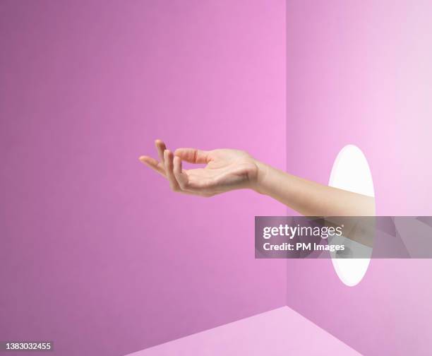 elegant hand reaching in - appearance foto e immagini stock