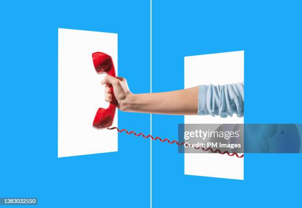 woman's hand thrusting red telephone - exclusive offer foto e immagini stock