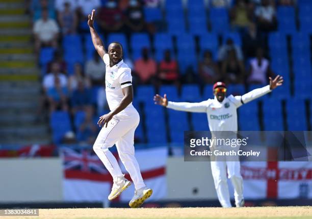 Kemar Roach of the West Indies successfully appeals for the wicket of Alex Lees of England during day one of the first test match between West Indies...