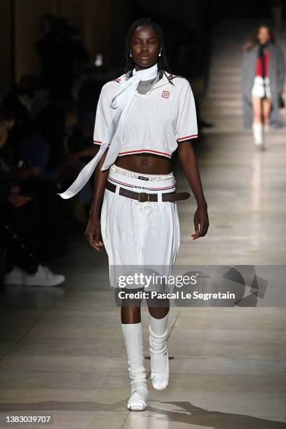 Model walks the runway during the Miu Miu Womenswear Fall/Winter 2022-2023 show as part of Paris Fashion Week on March 08, 2022 in Paris, France.